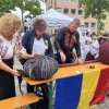 Două recorduri mondiale stabilite de românii din Nürnberg: 1.667,41 m de brâu românesc, cu o greutate de 70 kg