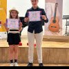 VIDEO: Doi frați din Alba Iulia, Anastasia și David Tudor, pe podium la un concurs de chitară ce a avut loc în Ungaria
