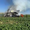 O combină agricolă a luat foc într-un lan de grâu la Grănicești (foto)